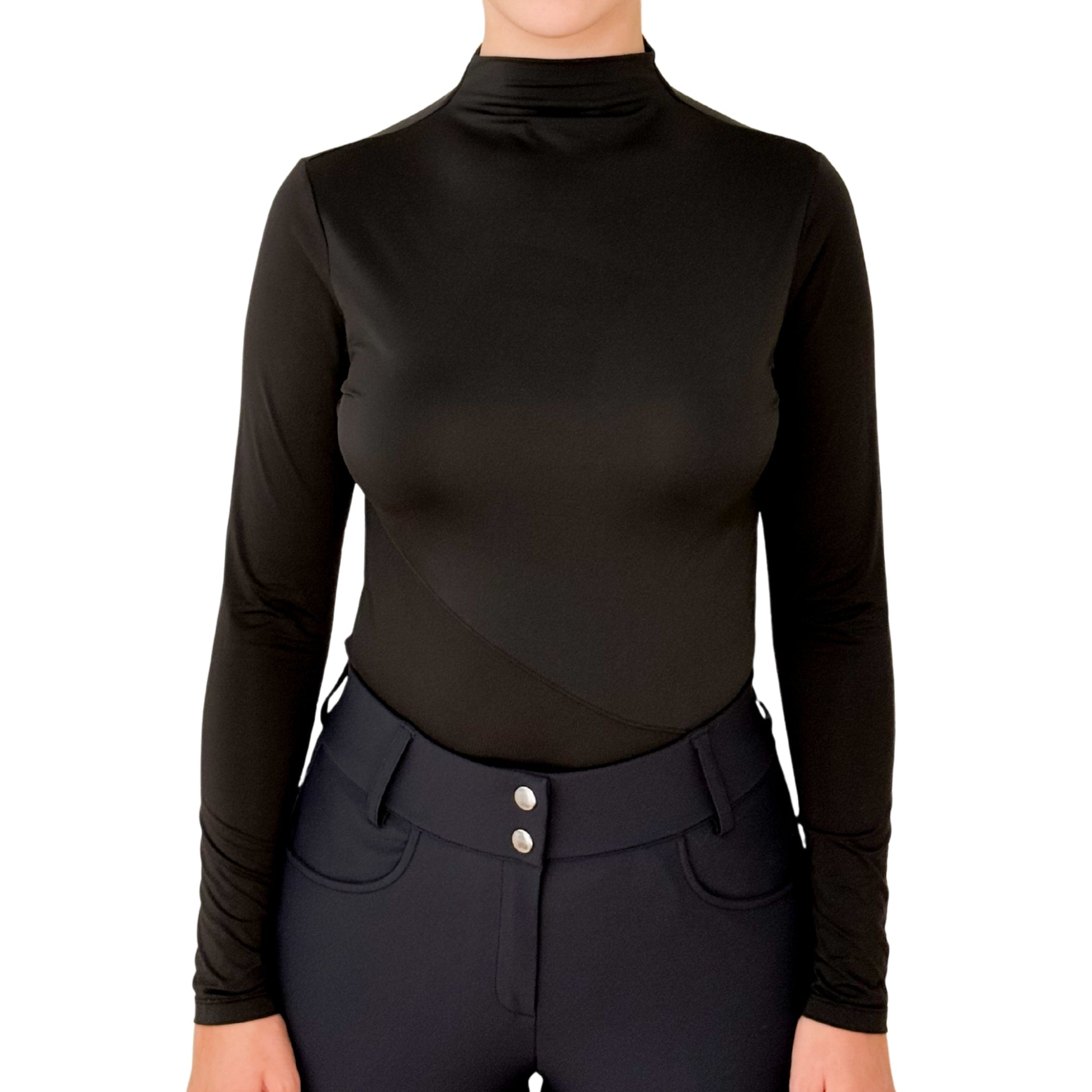 Person wearing a black long-sleeve top and black riding pants on a white background